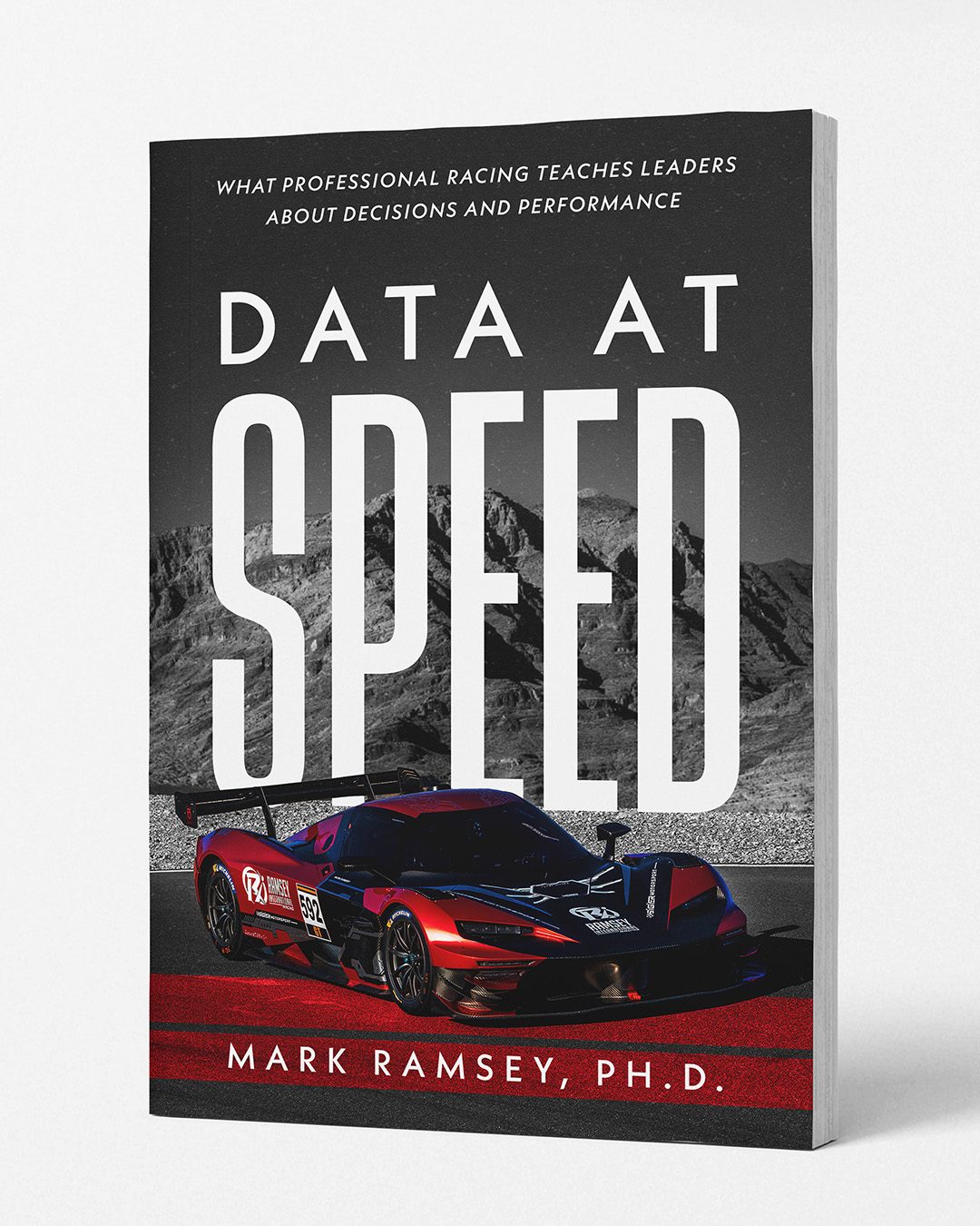 Data at Speed book cover — red and black race car number 592 in front of desert mountains
